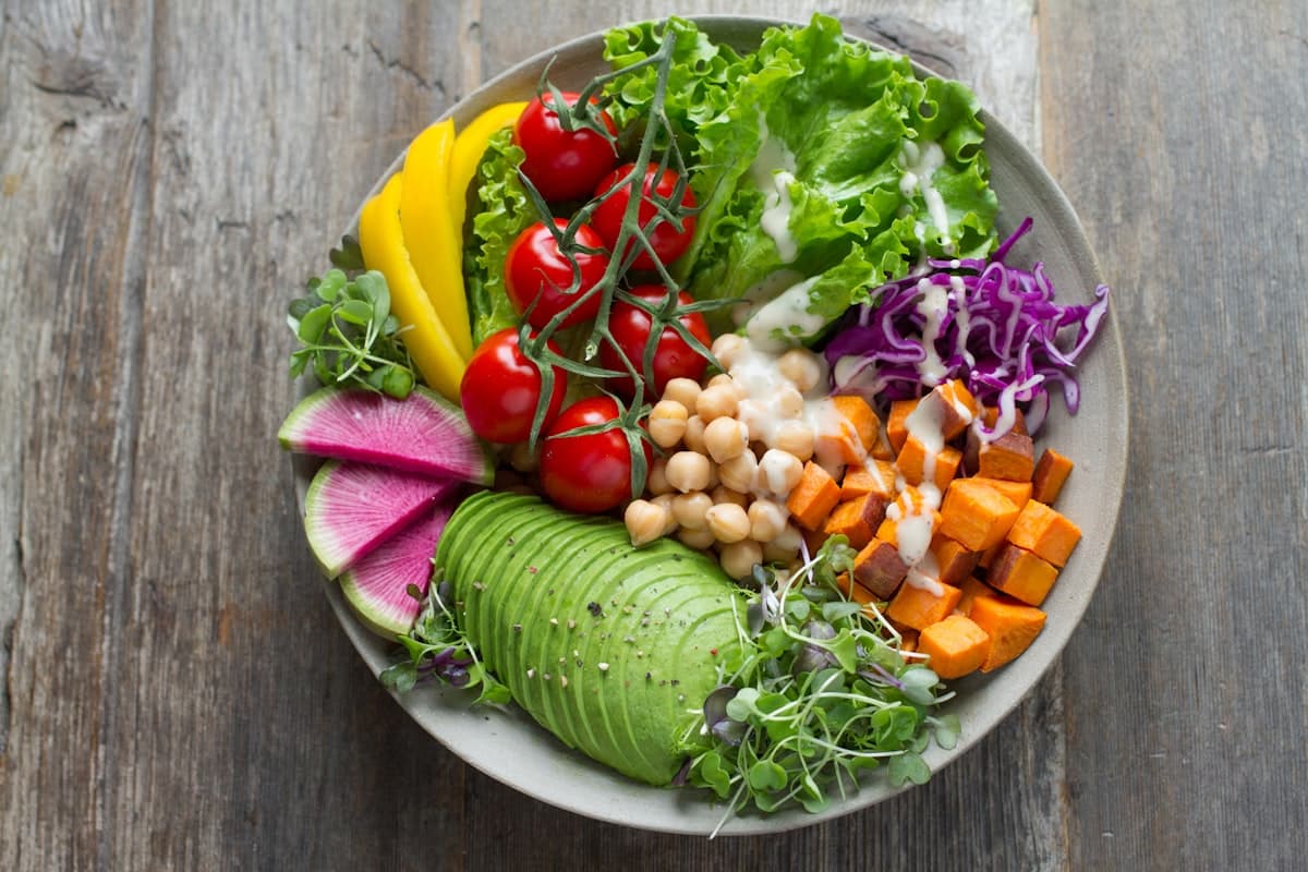 Colorful healthy meal bowl with avocado and vegetables